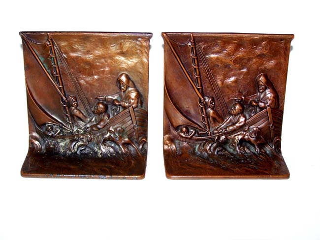 A Charming Pair of Antique Bronze Bookends circa 1925 depicting four fisherman in a boat